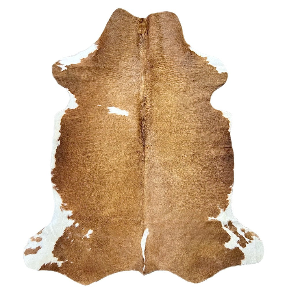 brown and white cowhide rug for sale