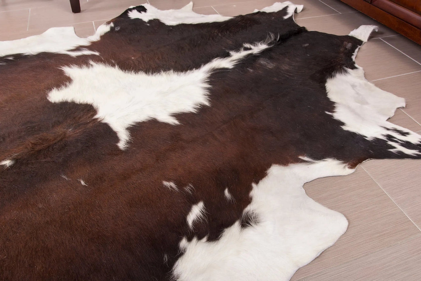Dark Brown and White Cowhide Rug
