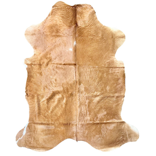 beige cowhide rug