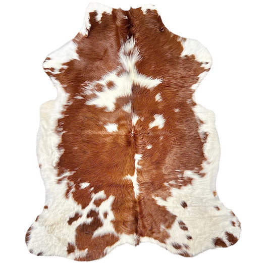 brown and white cowhide rug for sale 